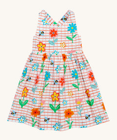 Frugi kids Delpi paint a floral dress - GOTS organic cotton kids dress with white check and red outline, sleeveless with a back strap fasteners. Features prints of different coloured flowers and bees.