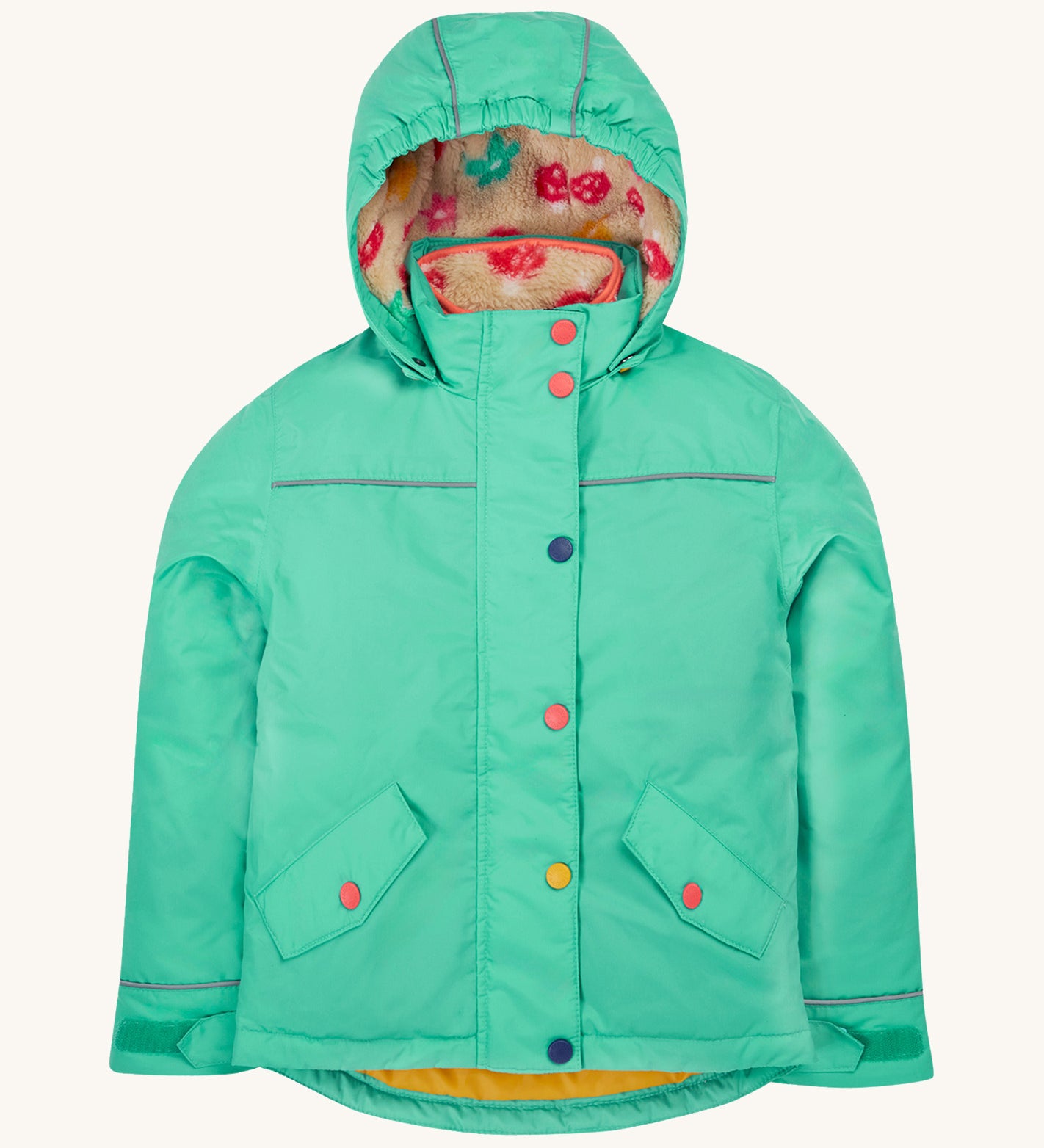 Frugi kids 3 in 1 rambler coat in dragon/mushroom colourway. A bright turquoise waterproof coat from post consumer recycled polyester. Features a removable hood and 2 side pockets with different colour poppers