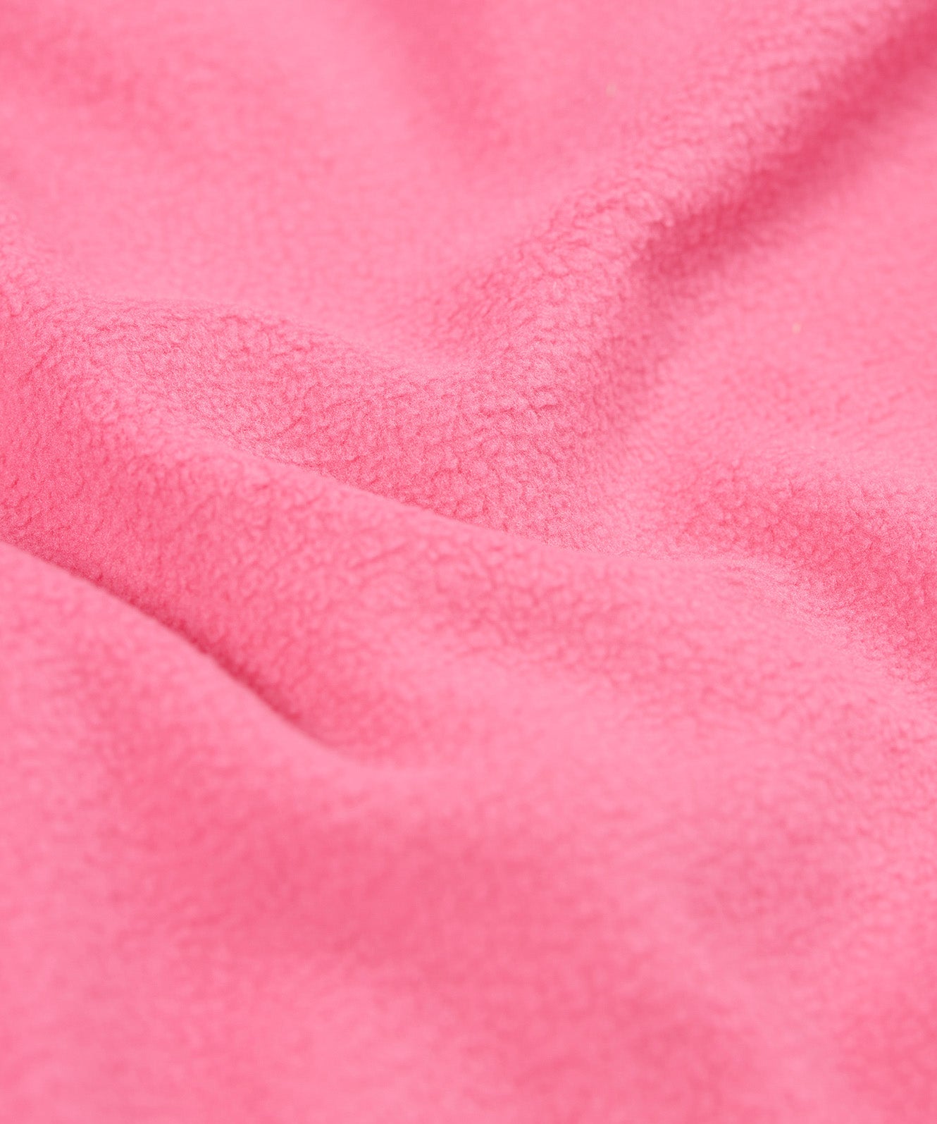 A close up of the pink fleece inside liner on the fun flowers Frugi puddle buster coat for warmth.