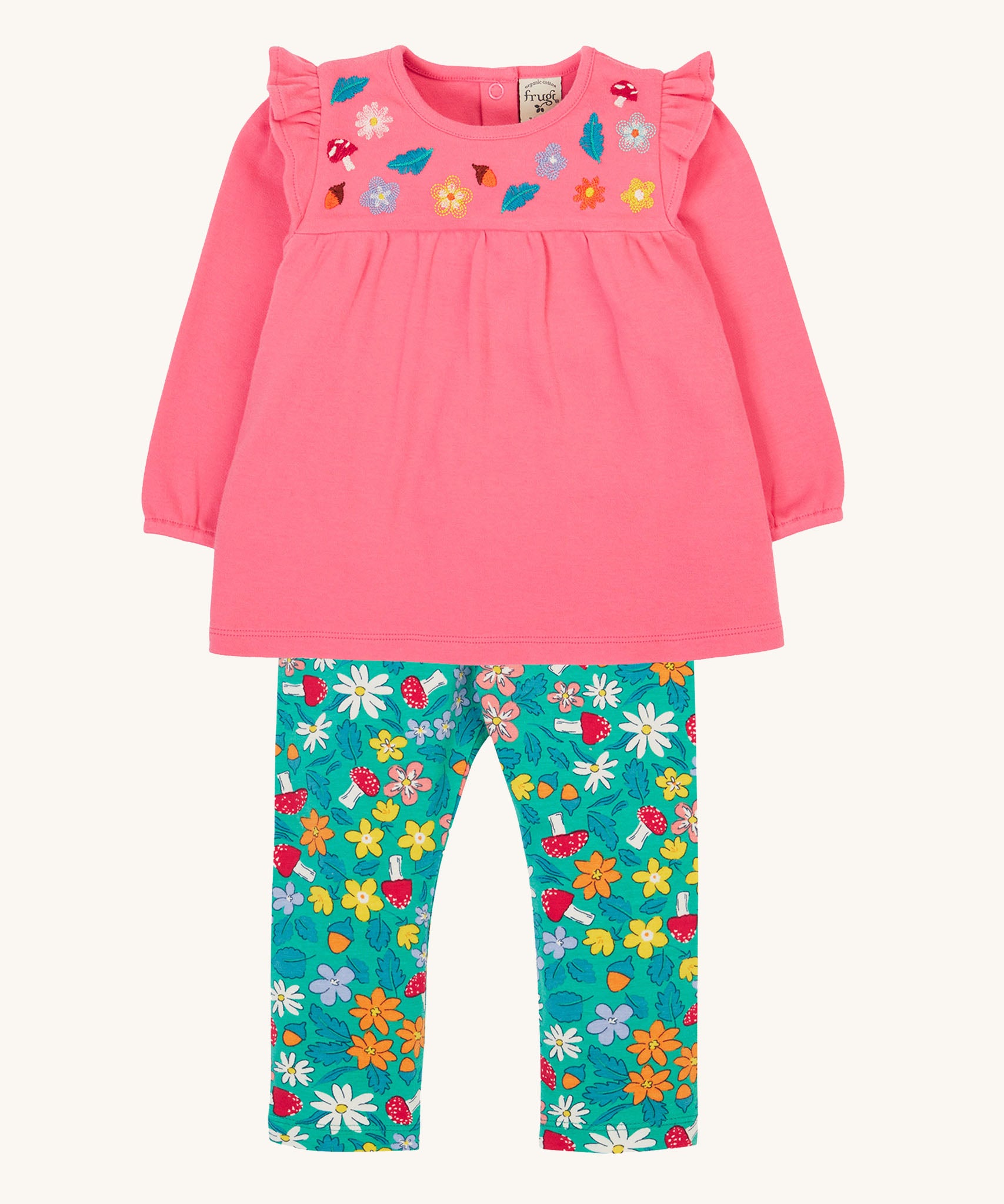 Frugi kids kyla outfit in tulip/wild woods available at Babipur. A GOTS organc cotton outfit which features a pink top with frilled shoulders and turquoise bottoms with woodland inspired prints