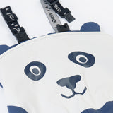 A close up of the panda design on the Frugi navy panda puddle buster trousers. Showing the character design on waterproof fabric and shoulder strap detail.
