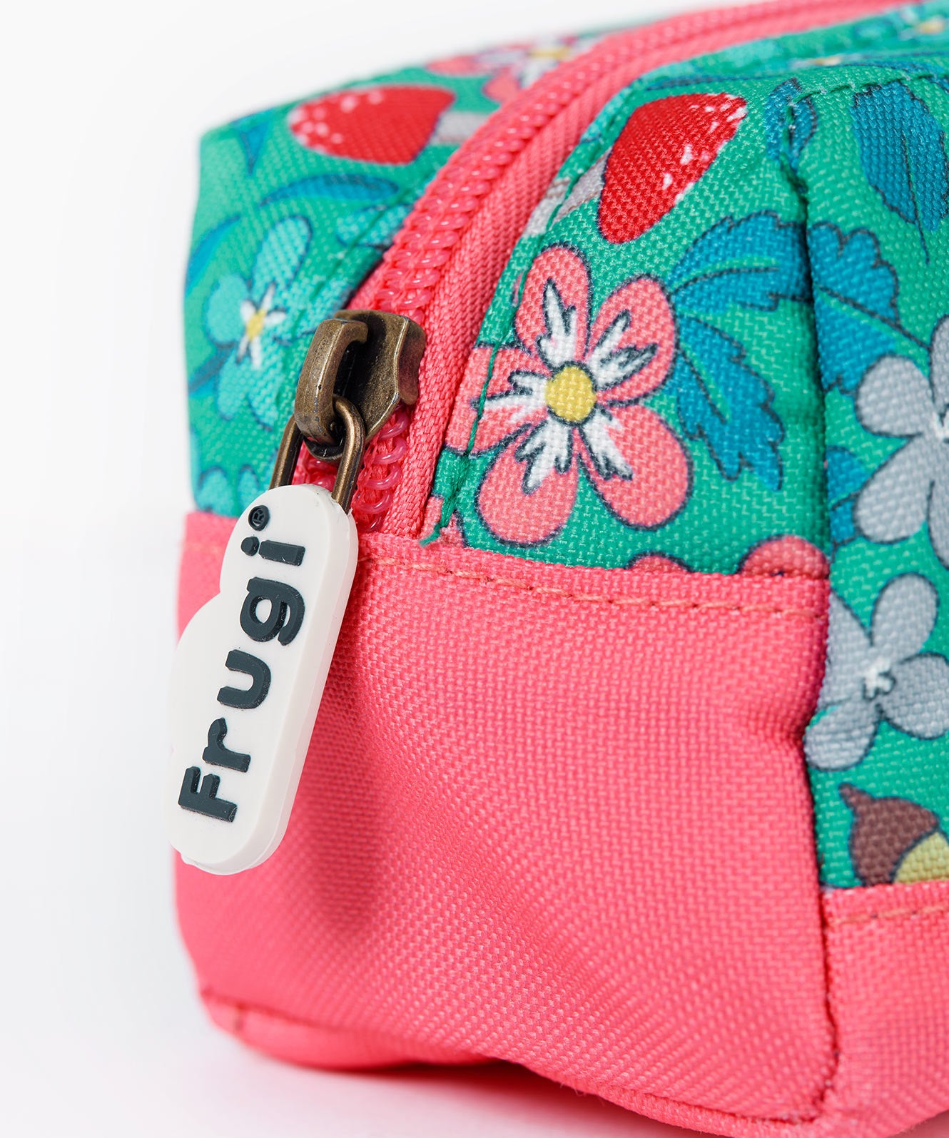 A close up of the Frugi wild woods pencil case. Showing the pink trim and zip detail