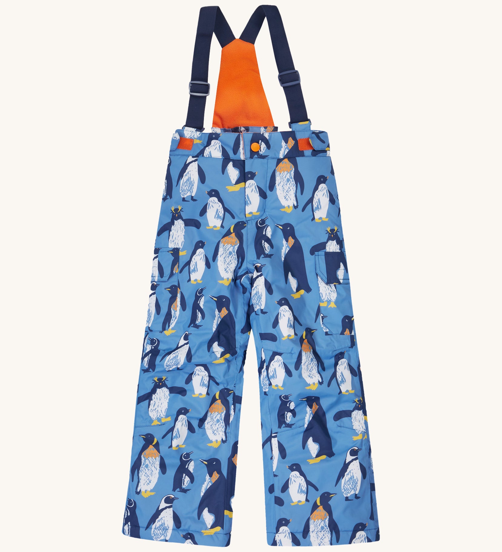 Frugi kids snow and ski salopettes in penguin waddle. A blue recycled polyester waterproof salopettes with waddling penguins. Features removable straps and bib.