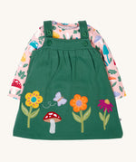 Frugi kids pippa holly green fun guys pinafore outfit available at Babipur. a 100% GOTs organic cotton outfit. Features a pink long sleeve top with cute woodland inspired prints and a green pinafore with flowers, mushroom and a bee applique