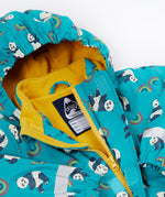 A close up of the Frugi kids panda play puddle buster coat showing the playful panda prints on light blue waterproof material. Features a full length zip, name tag patch and velcro fasteners for a secure fit.