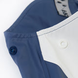 A close up of the popper detail located on the top side on the Frugi navy panda puddle buster waterproof trousers for a snug fit.