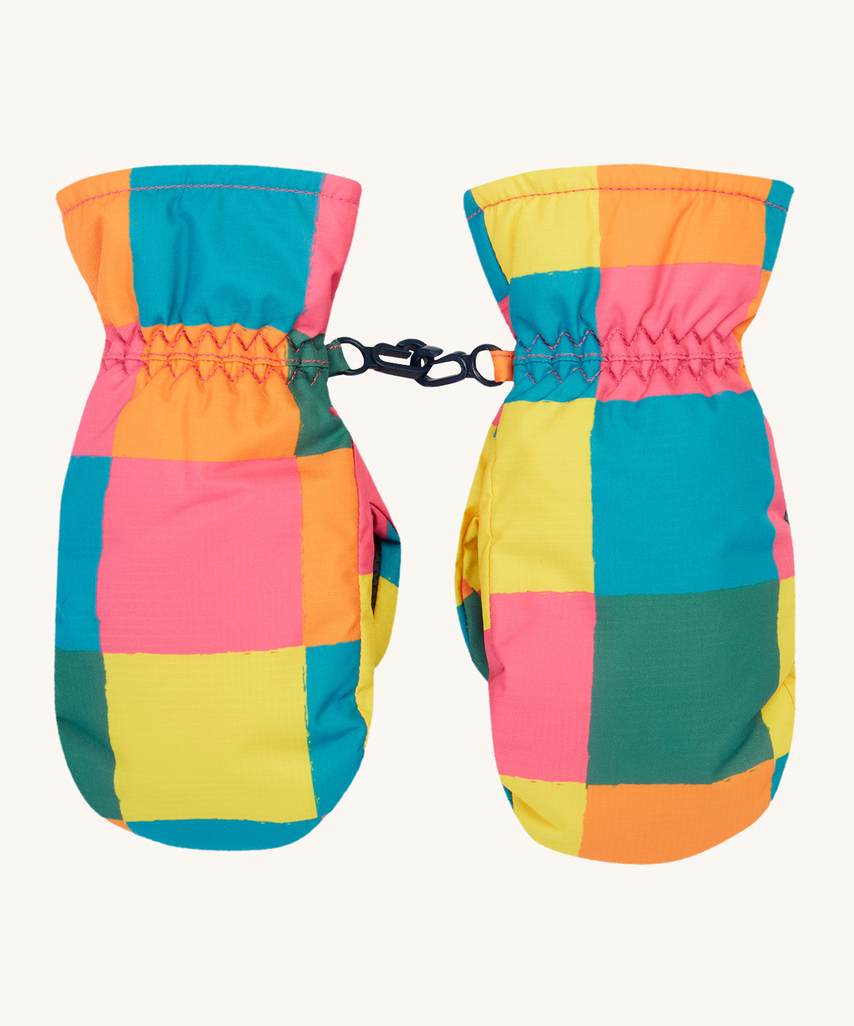 Frugi kids rainbow check snow mittens. A pair of recycled polyester winter mittens in a bright check design. features a black clip on each mitten to attach on a ski coat.