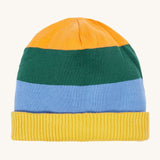 A close up of the Frugi reversible voyager hat showing the bold yellow, green and blue striped design on GOTS organic cotton fabric with a yellow soft ribbed trim.