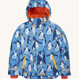 Frugi kids snow and ski coat in penguin waddle. A light blue thick recycled polyester coat with a padded orange inner. Features a hood, 2 side pockets, extendable arm cuffs with reflective strips