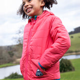 A child wearing the Frugi toasty trail reversible jacket showing the light pink coloured with pink zip detail and a brand patch on the side pocket on post consumer recycled polyester fabric.