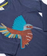 A close up of the embroidery on the front of the Frugi navy kingfisher Organic Cotton Embroidered long sleeve children's Top. This top is a part of a wide range of organic cotton clothing for children available here at Babipur.