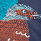 A super zoomed in view of the embroidered kingfisher detail on the front of the Frugi navy kingfisher Organic Cotton Embroidered long sleeve children's Top. This top is a part of a wide range of organic cotton clothing for children available here at Babipur.