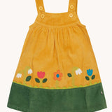 Frugi Nellie Organic Cotton yellow gold Corduroy Pinafore Dress with Flowers. This dress is a part of a wide range of organic cotton clothing for children available here at Babipur.