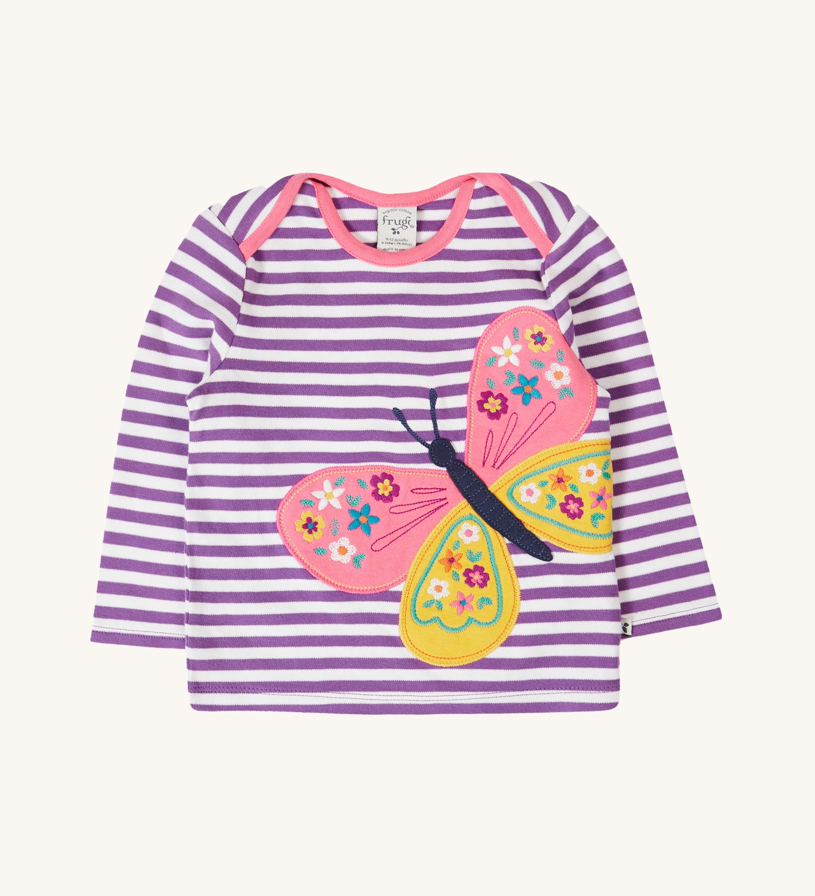 Frugi Children's organic cotton Bobby butterfly Applique purple striped  long sleeved Top. The top has a violet purple and white stripe background with a large decorated butterfly applique on the front. This top is a part of a wide range of organic cotton clothing for children available here at Babipur.