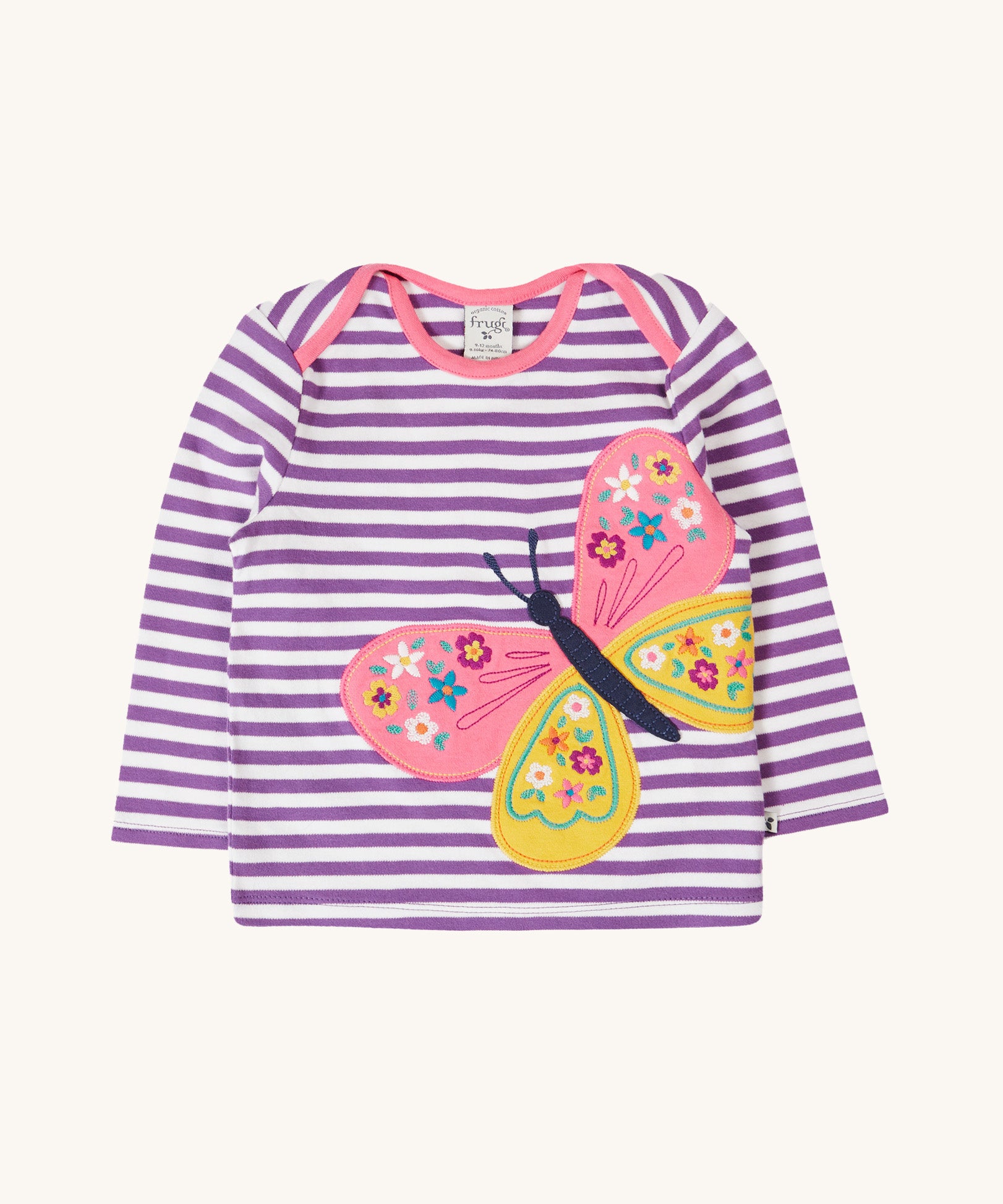 Frugi Children's organic cotton Bobby butterfly Applique purple striped  long sleeved Top. The top has a violet purple and white stripe background with a large decorated butterfly applique on the front. This top is a part of a wide range of organic cotton clothing for children available here at Babipur.