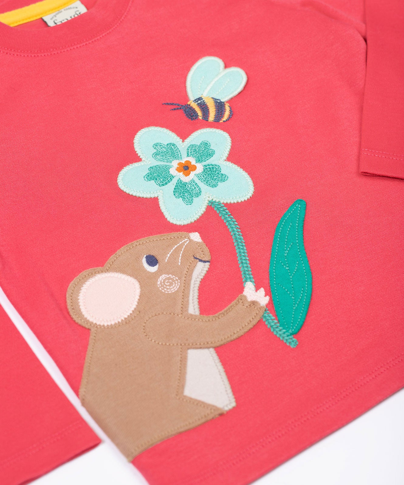 A close up of the front of the Frugi rose pink Organic Cotton Adventure mouse Applique long sleeved children's Top. This top is a part of a wide range of organic cotton clothing for children available here at Babipur.