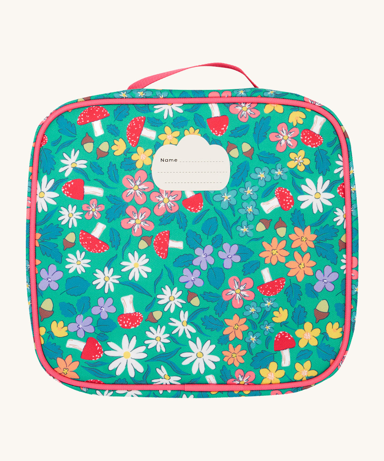 The back of the Frugi kids pack a lunch bag in wild woods showing the name tag patch on the top.