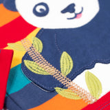 A close up of the embroidered bamboo detail on the panda applique on the front of the Frugi Children's Bobby panda Applique rainbow striped Organic Cotton long sleeved Top. This children's top is part of a wide range of organic cotton clothing available here at Babipur.