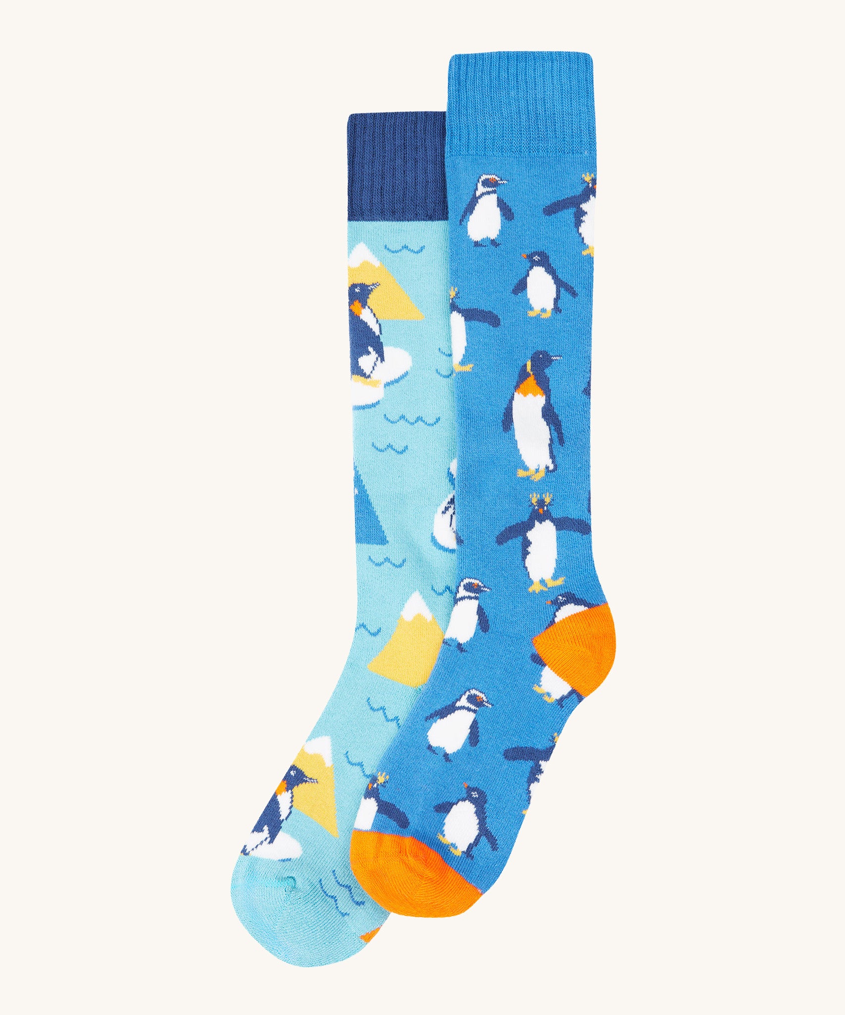 Frugi penguin brilliant boot sock 2 pack - GOTS organic cotton high socks in light and dark blue with different penguins. Features a light elasticated cuff for a snug fit