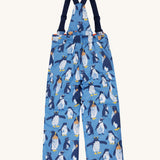 The back of the Frugi kids snow and ski salopettes in penguin waddle. showing the elasticated waist band detail on blue recycled polyester fabric