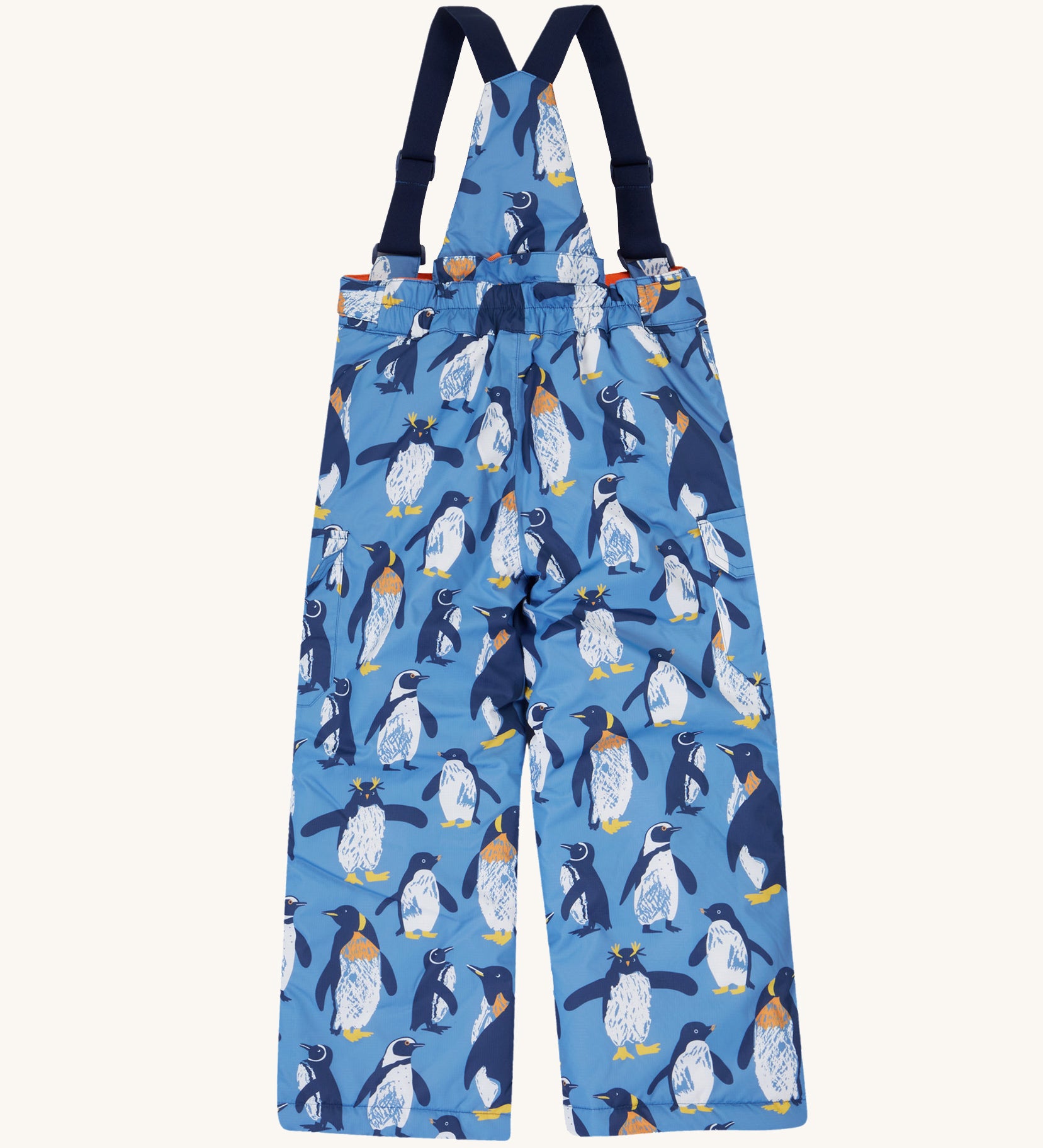 The back of the Frugi kids snow and ski salopettes in penguin waddle. showing the elasticated waist band detail on blue recycled polyester fabric