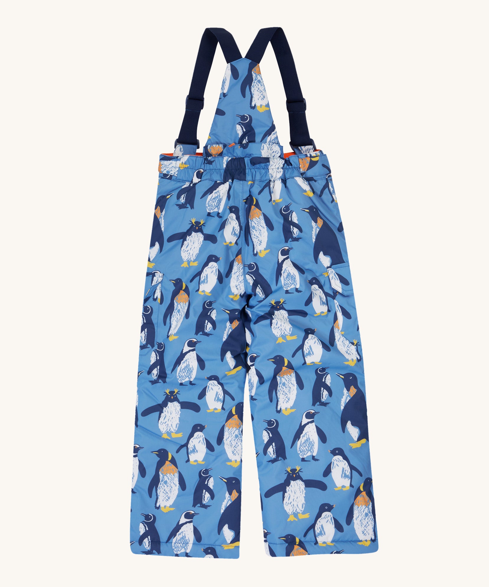The back of the Frugi kids snow and ski salopettes in penguin waddle. showing the elasticated waist band detail on blue recycled polyester fabric