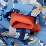 A close up of the Frugi kids snow and ski coat in penguin waddle showing the orange storm cuff detail and reflective strips