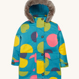 Frugi kids penhale super spot parka- A long length light blue thick coat with a big coloured circles design. Features a blue fleece inner and furry hood for warmth, full length button decoration and 2 side pockets on organic cotton fabric