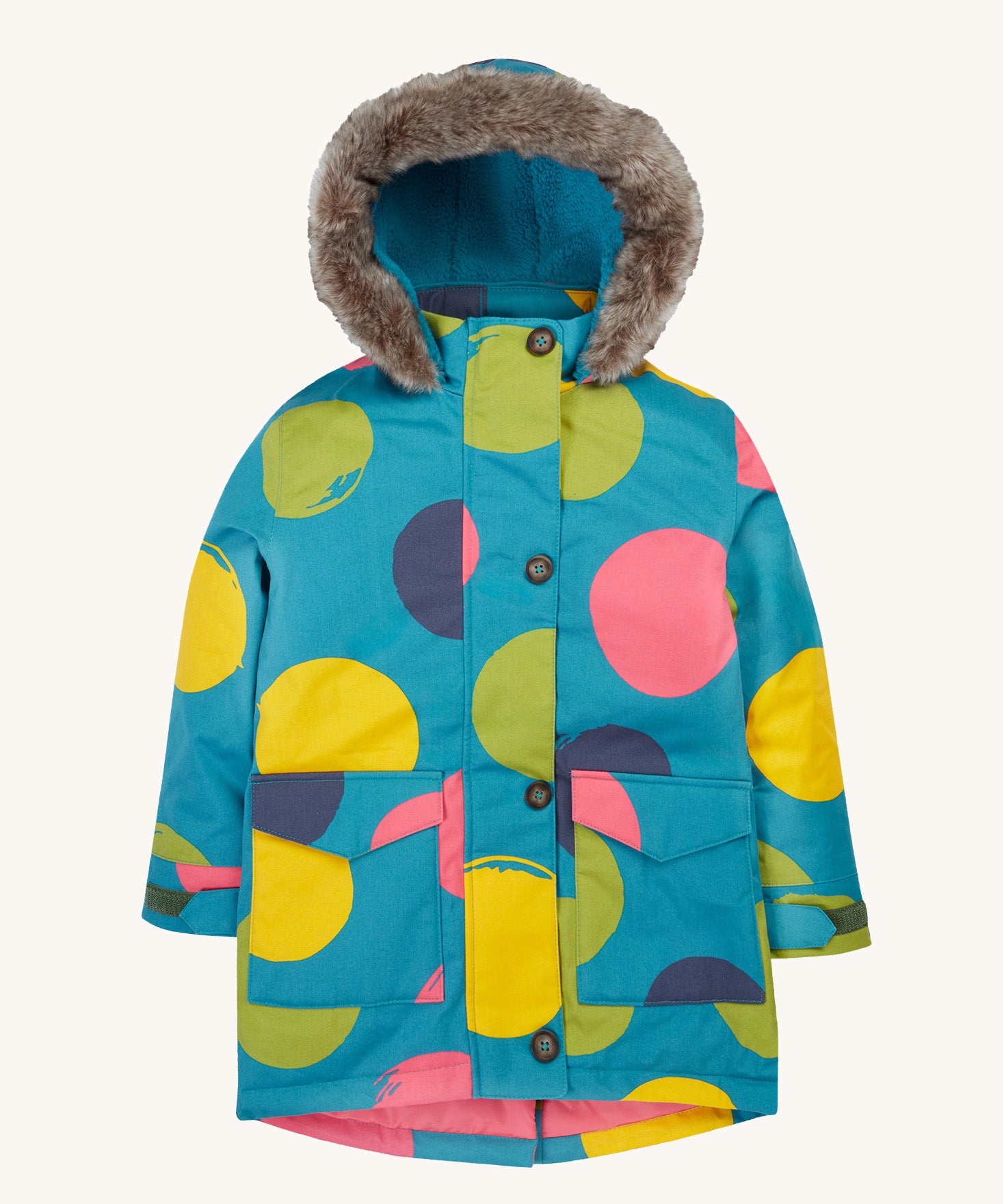 Frugi kids penhale super spot parka- A long length light blue thick coat with a big coloured circles design. Features a blue fleece inner and furry hood for warmth, full length button decoration and 2 side pockets on organic cotton fabric