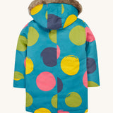 The back of the Frugi penhale super spot  parka. A thick long length light blue hooded coat with big circles printed all over