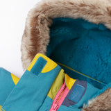 A close up of the Frugi super spot penhale parka showing the soft furry hood with blue fleece inner liner and velcro fastener for a secure fit. Features a full length zip in pink trim.