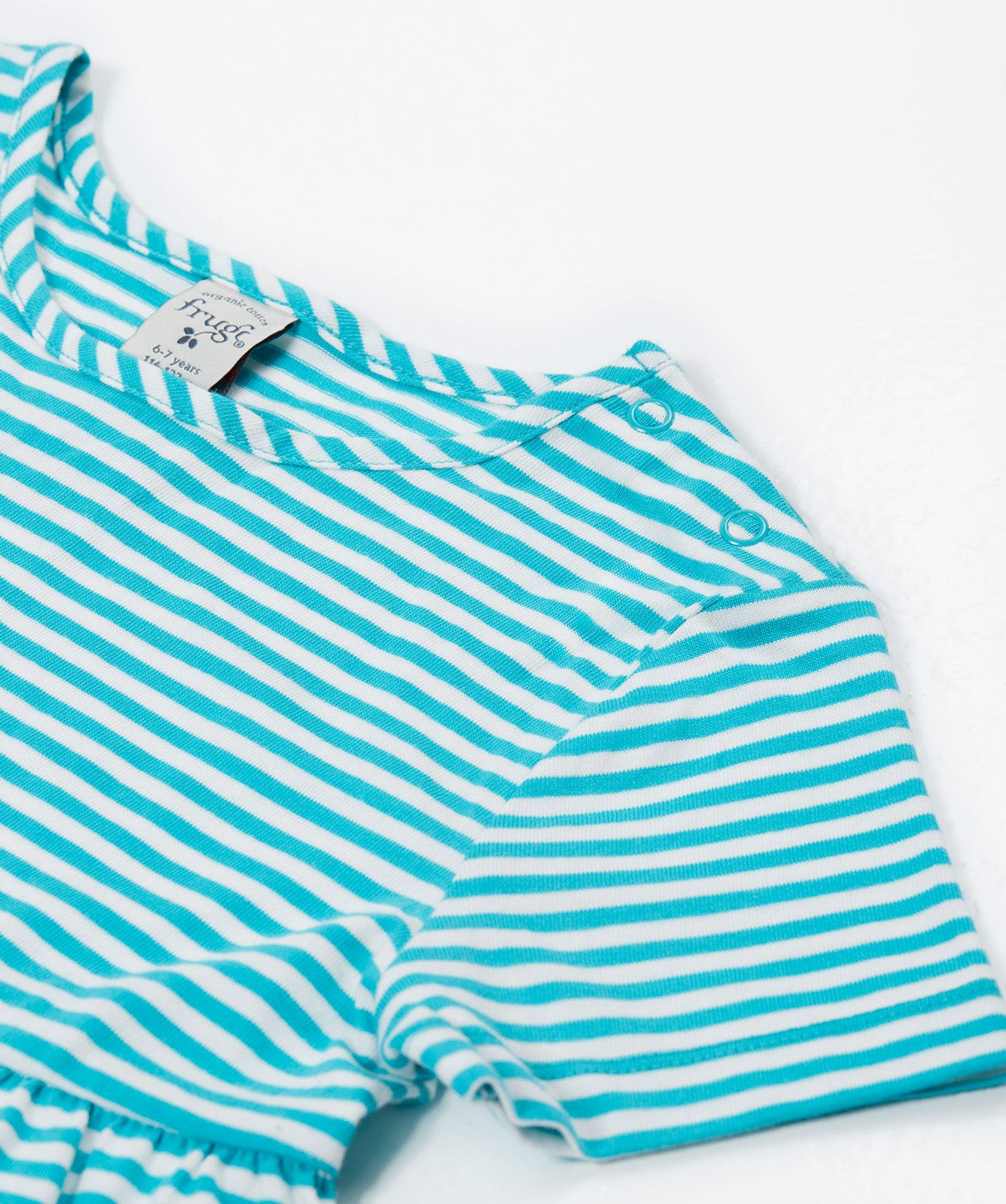 A close up of Frugi Pixy Sea Moss Mini Stripe Dress, featuring popper fastenings.