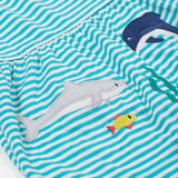 A close up of Frugi Pixy Sea Moss Mini Stripe Dress, with a Sealife print along the bottom, featuring a shark, a dolphin and a small fish.