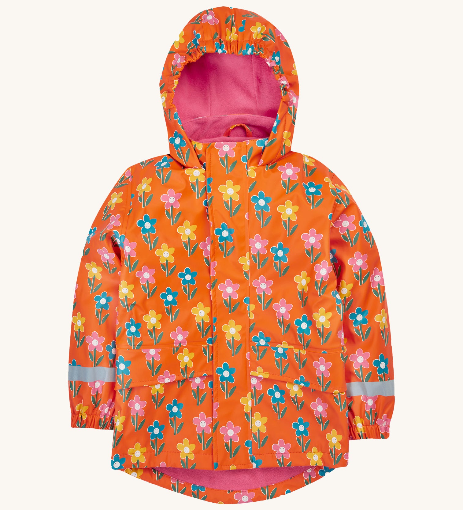 Frugi kids puddle buster coat in fun flowers. A orange waterproof hooded coat with multiple playful prints of flowers with faces and a pink fleece on the inside. Features 2 side pockets, reflective strips on the wrist cuffs and a hook on the inside to hang up.