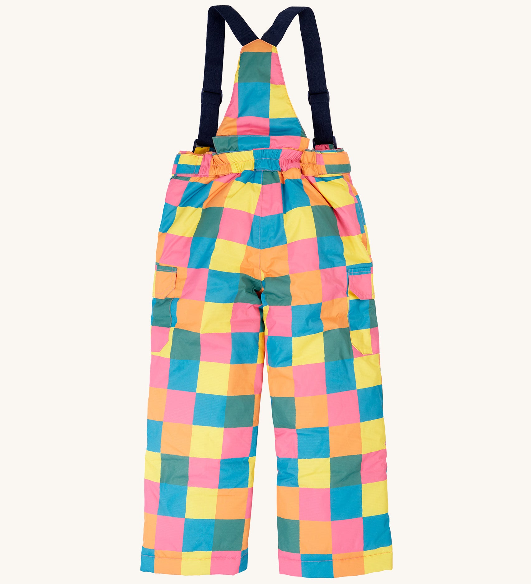 The back of the Frugi kids snow and ski salopettes in rainbow check. showing the elasticated waist band detail on brigh tchecked recycled polyester fabric