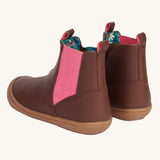 A view of the back of the Frugi Ravine easy on children's leather boots in a brown, wild woods design. The boots have a pull tab to help easy ons and offs.