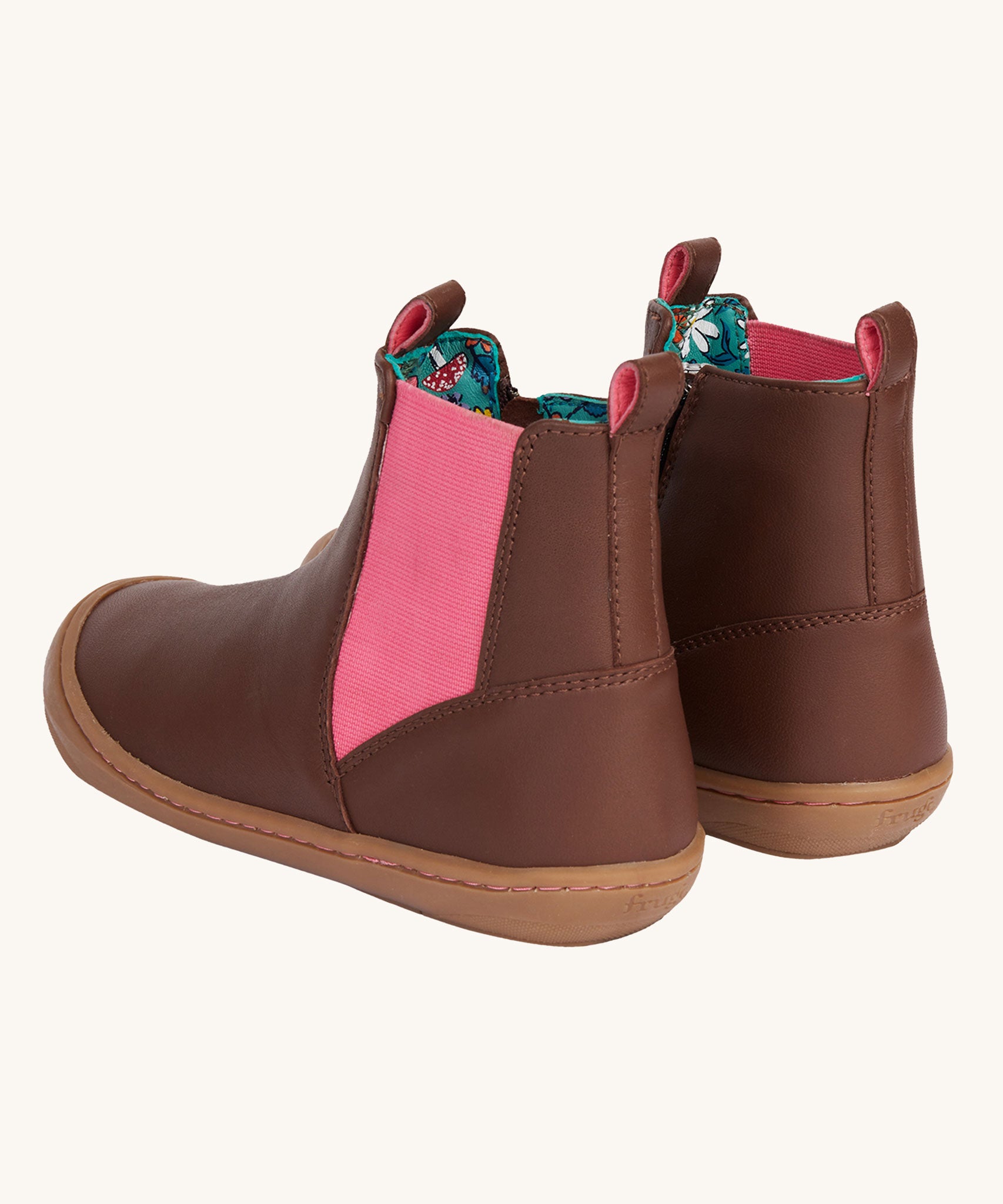 A view of the back of the Frugi Ravine easy on children's leather boots in a brown, wild woods design. The boots have a pull tab to help easy ons and offs.