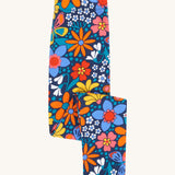Frugi Retro Floral Leona Organic Cotton Kids' Leggings. A navy coloured legging with a bright multicoloured retro style flower print all over. These leggings are part of a wide range of organic cotton clothing for children available here at Babipur.