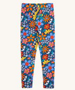 Frugi Retro Floral Leona Organic Cotton Kids' Leggings. A navy coloured legging with a bright multicoloured retro style flower print all over. These leggings are part of a wide range of organic cotton clothing for children available here at Babipur.
