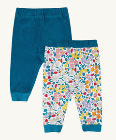 Frugi Poppy Reversible Pull Ups - Blue / Wild Woods available at Babipur. A pair of GOTS organic pull up trousers with one side that's blue and the reverse side with a floral design. Features a elastic waist band and cuffs.