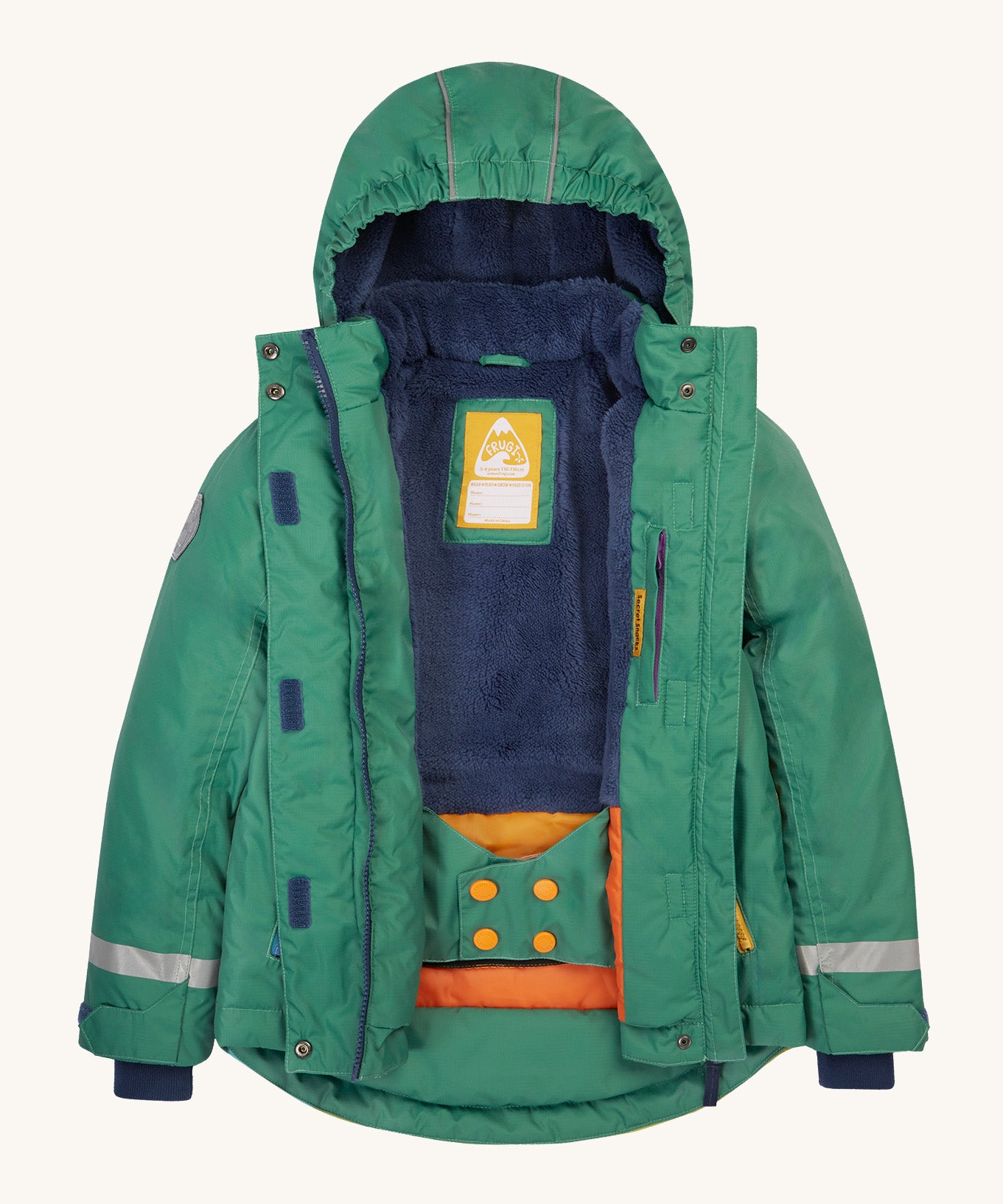Frugi kids snow and ski coat in green with a mountain scene print. Opened to reveal the thick and warm thick navy fleece inner with a name patch stitched inside. Features a full length zip with velcro fasteners.