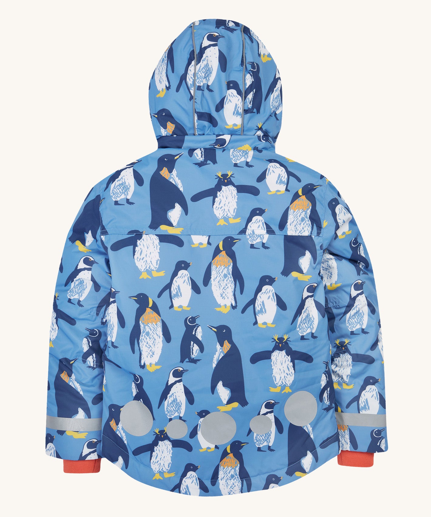 The back of the Frugi kids snow and ski coat in penguin waddle showing the hood detail, orange storm cuffs and reflective strips and patches on blue recycled polyester fabric