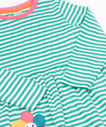 A close up of the Frugi kids tammy dress in dragon stripes/flowers showing the long sleeve and pink trim detail on striped organic cotton fabric.