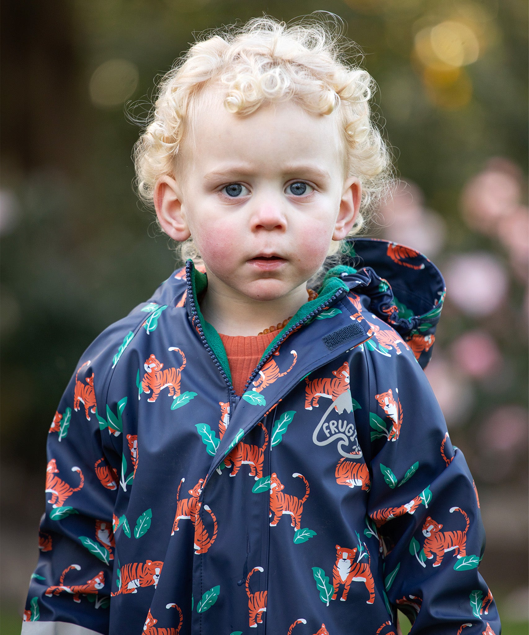 wearing the Frugi Children's Puddle Buster All In One - Tiger Time
