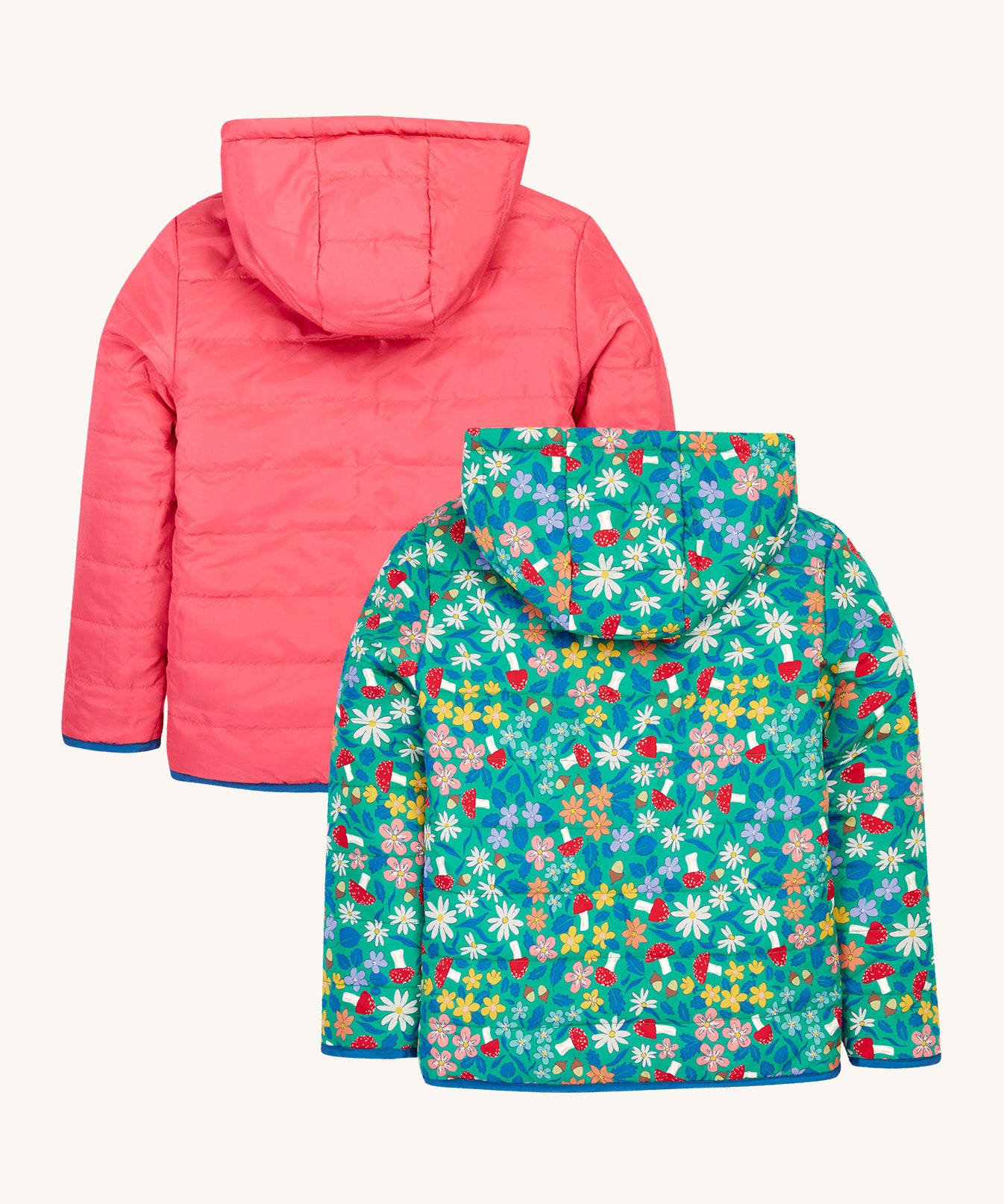 The back of the Frugi kids toasty trail reversible jacket in wild woods and tulip colour way showing the hood detail and blue trim on the arm cuff and hem