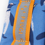 A close up of the shoulder strap on the Frugi kids trail blazing backpack in penguin waddle. Showing the reflective strip running down the strap