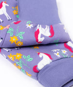 A close up of the fold-able cuffs on the Frugi Organic Cotton purple unicorn floral print Children's Big Snuggle Suit. This all in one snuggle suit is a part of a wide range of organic cotton clothing for children available here at Babipur.