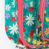 A close up of the Frugi kids pack a lunch bag in wild woods. Showing the pink trim and zip detail