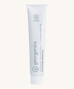 Front view of the Georganics activated charcoal hydroxyapatite toothpaste. A white tube with grey and black branding text.