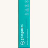 Front view of the Georganics activated charcoal hydroxyapatite toothpaste cardboard packaging, light green box with white and blue branding text.
